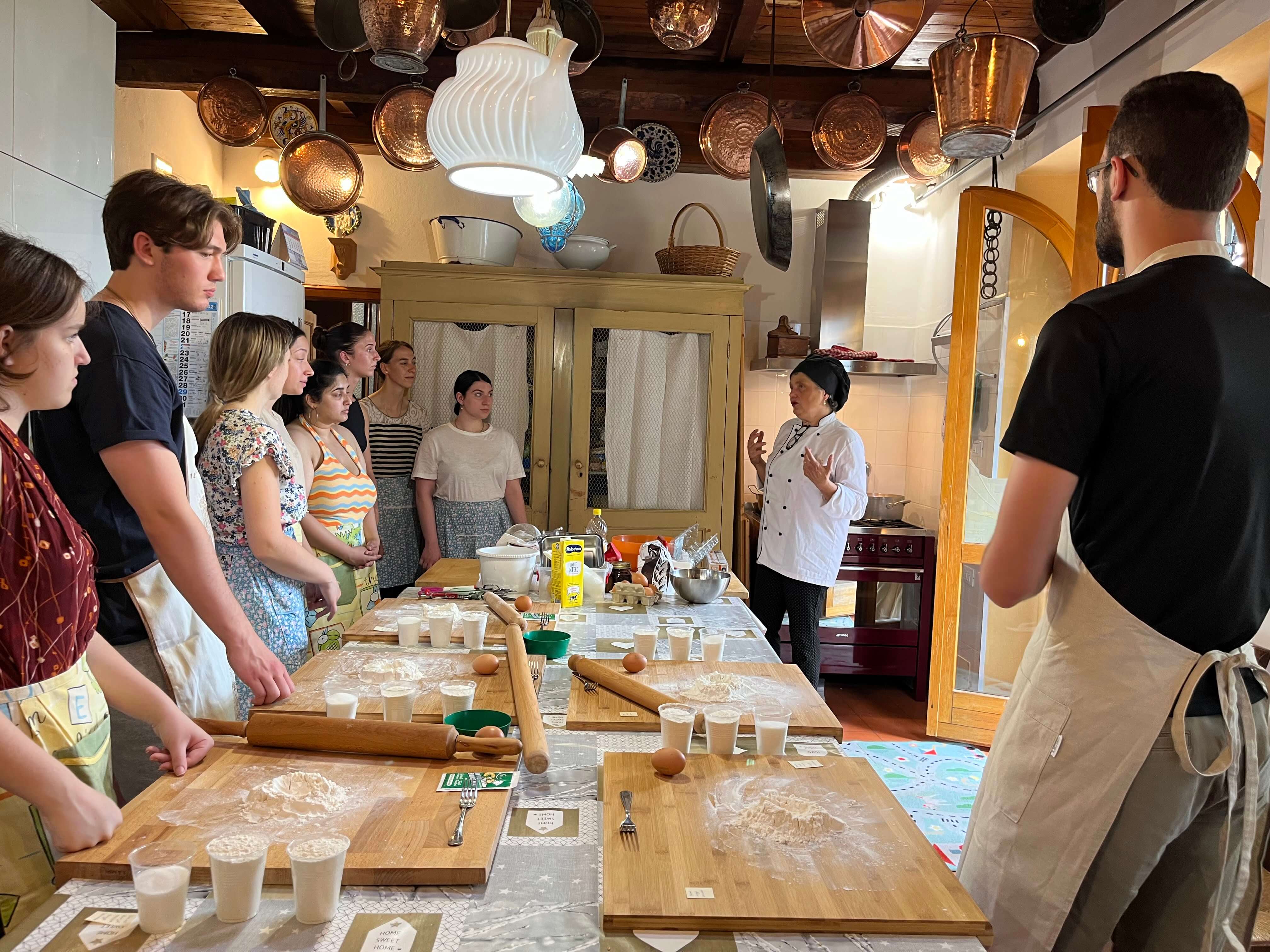 Students learning how to make pasta in Bologna, Italy