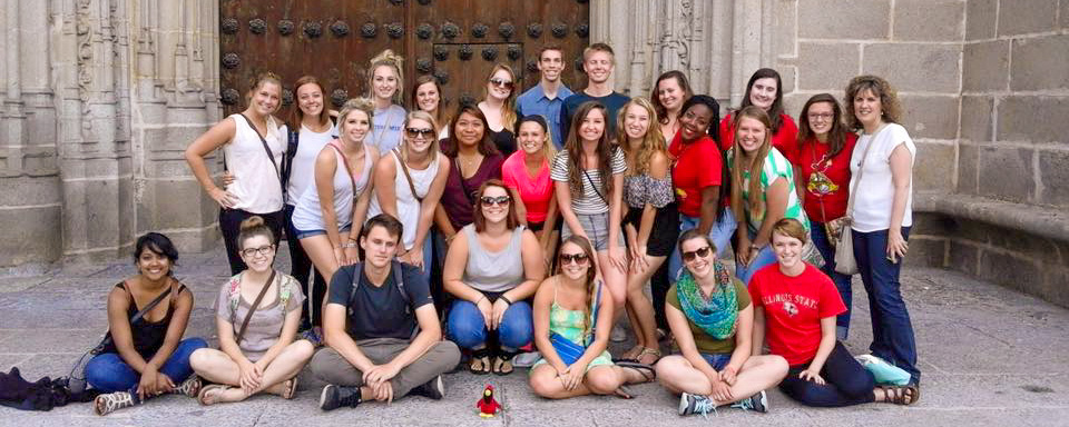 Group of students posing in front of an old church in Avila
